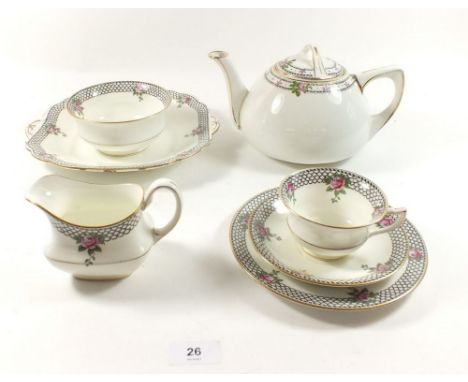 An Aynsley tea service printed roses and a black scale border comprising: twelve cups and twelve saucers, milk, sugar, two ca