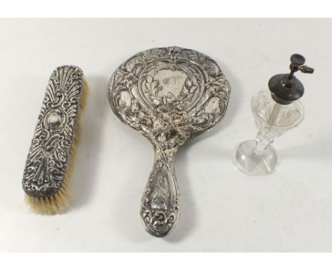 A silver brush and mirror and a cut glass and silver mounted atomiser 