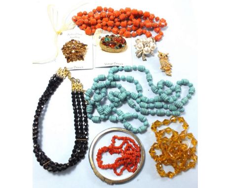 A collection of vintage and later costume jewellery to include brooches, bangle etc 