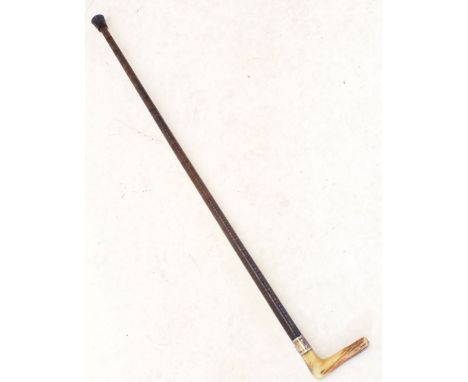 A horn handled and leather clad walking stick with silver plated collar