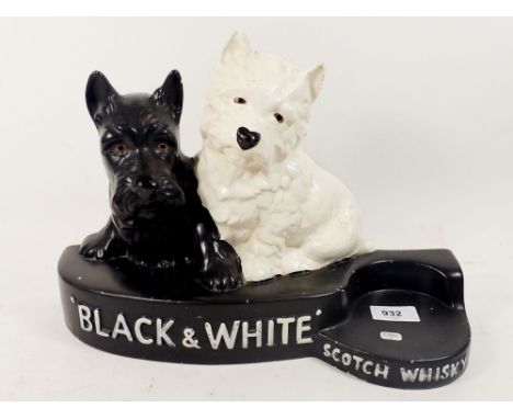 A Brentleighware 'Black and White Scotch Whisky' advertising bar stand with two terriers, 36 x 24cm