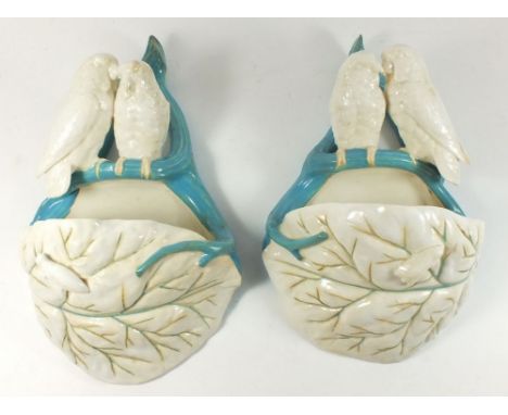 A pair of 19th century Royal Worcester wall pockets with pairs of birds on leaves, 27cm 
