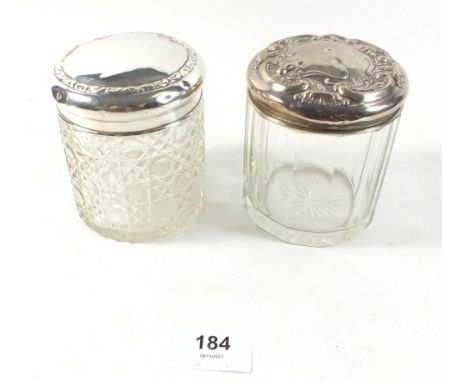 Two cut glass and silver topped toiletry jars