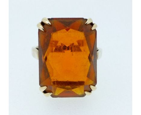 A 9 carat gold dress ring set orange stone, size K, 4.6g 