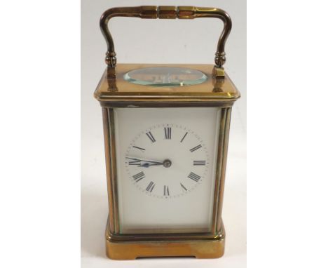 A 19th century brass striking carriage clock with key, 17.5cm tall 