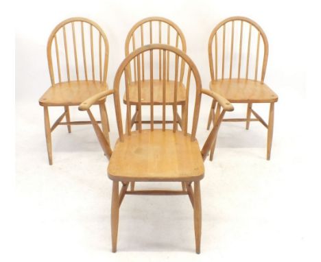 A set of four Ercol stick back dining chairs 