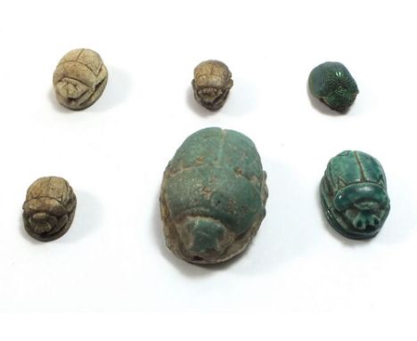 A scarab beetle and five Art Deco ceramic scarab beetles 