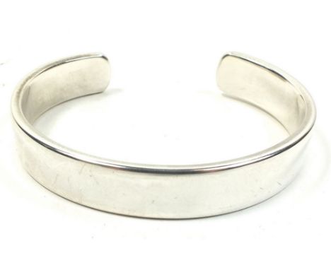 A silver bangle by Daryl Locke, 60g 