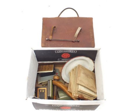 A box of miscellaneous collectables including cigarette cards, enamel ware, pair of wooden shoe lasts, army items etc. 