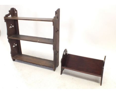 An oak open wall shelf with pierced decoration and a mahogany book rack, 38cm wide 