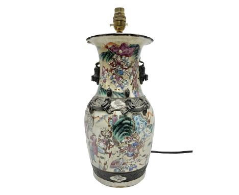 Chinese vase of baluster form, converted to a lamp base, in the Nankin style, decorated with a battle scene with oxidised tri