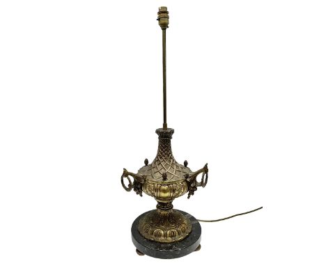 Cast brass table lamp, with lattice and foliate decoration and three loop handles, the marble base upon three bun feet, H71cm