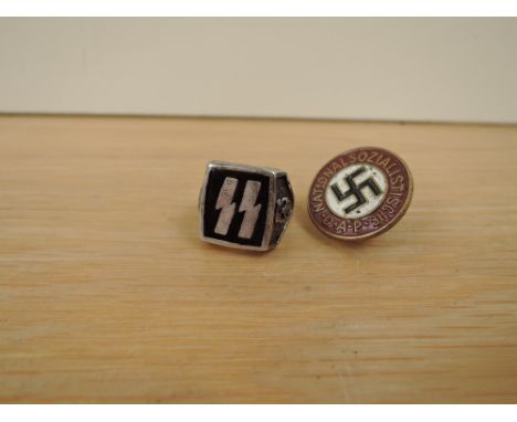 A German white metal SS Ring having marks on inside G &amp; S 85 along with a National Sozialistische D.A.P Badge