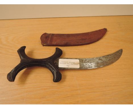 A Sudan Beja having wooden X Grip, blade length 19cm, overall 29cm, in decorated leather scabbard