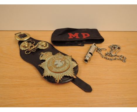 A MP (Military Police) 1949 Cloth Armband, black with red lettering along with a Hudson &amp; Co Whistle marked with Crows ar