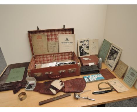 A leather case containing a collection of Military items including loose Military Photographs and a album of Military Photogr