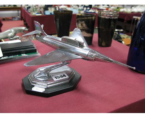 A Chrome Desk Cigarette Lighter, as an aeroplane, on octagonal stepped base, registered design, 869697 069675, 23cm long.