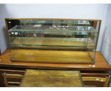 A Mid 1900's Shop Counter Cabinet, with internal shelf and wooden base, 42" long.