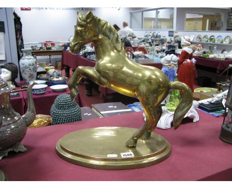 A Brass Model of a Rearing Horse, on stepped oval base.
