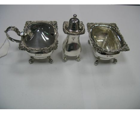 A Matched Hallmarked Silver Three Piece Cruet Set, each with textured edge, raised on four scroll feet, CB&S, Sheffield 1936,