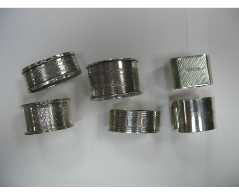 Six Assorted Hallmarked Silver Napkin Rings, including engine turned and initialled. (6)