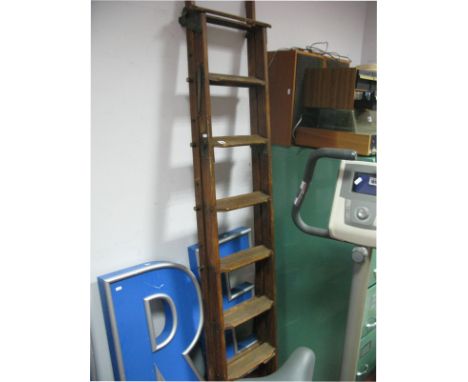An Early 1900's Two Section Library Ladder, with adjustable locking mechanism. 