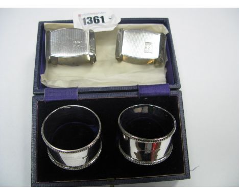 A Pair of Hallmarked Silver Napkin Rings, (marks rubbed), in a fitted case; together with another pair of hallmarked silver n