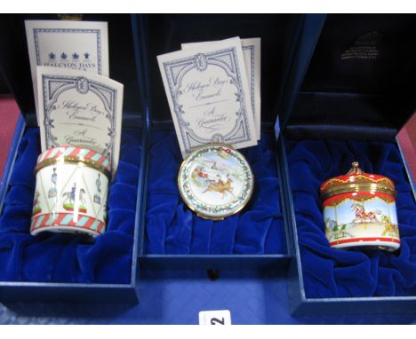 Three Halcyon Days Enamel Musical Boxes: playing The Carousel Waltz, The Toy Symphony and White Christmas, all boxed. (3)