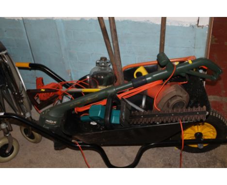 A GARDEN WHEELBARROW, WITH TOOLS TO INCLUDE A HEDGE-TRIMMER