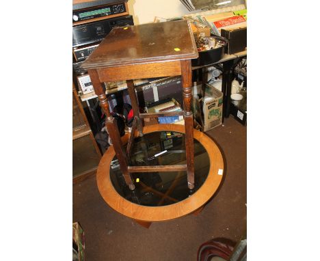 A RETRO CIRCULAR GLASS TOPPED COFFEE TABLE TOGETHER WITH ANOTHER