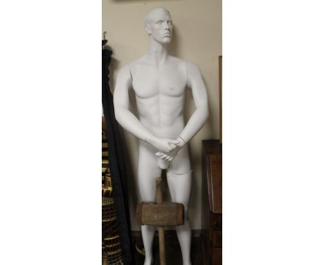 A LARGE MALE MANNEQUIN 