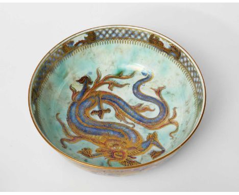 A Wedgwood Pottery Dragon Lustre bowl designed by Daisy Makeig-Jones, printed inside with a large Chinese dragon in blue and 