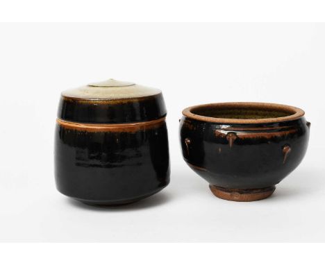 Phil Rogers (1951-2020)Storage jar and covertapering cylindrical form, covered in a rich tenmoku glaze over ashimpressed seal