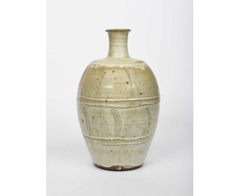 Φ Phil Rogers (1951-2020)Bottlestoneware bottle, shouldered form with incised comb bands, covered to the foot in a pale ash g