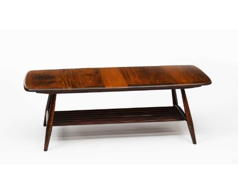 An Ercol stained elm coffee table designed by Lucian Ercolani,  model no.398, rectangular section with flaring legs, unsigned