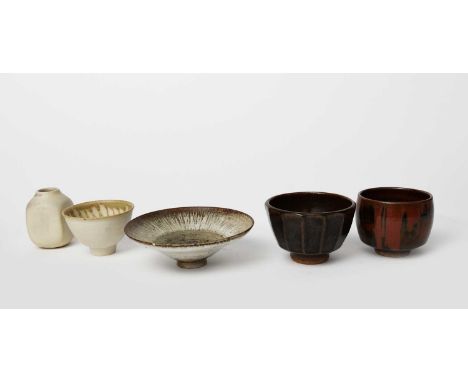 Geoffrey Whiting (1919-1988)Unomistoneware footed form, covered in a running rust over tenmoku glaze, another larger, a porce