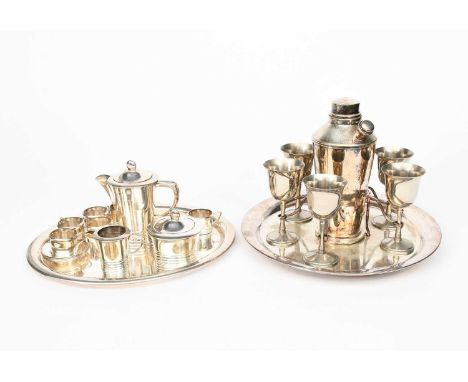 An Art Deco English electroplated cocktail shaker set, hydrant style shaker with fitted tray and six goblets, and a continent