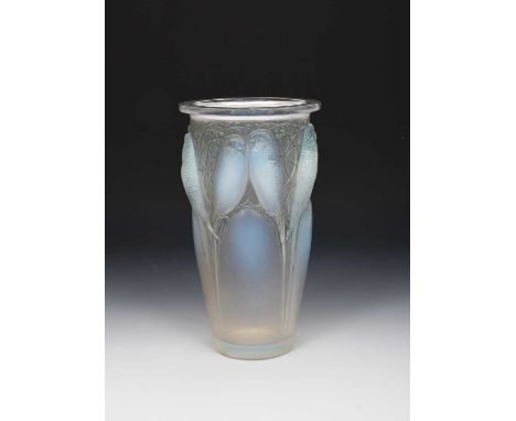 'Ceylan' no 905 a Lalique opalescent glass vase designed by Rene Lalique, moulded in relief, with blue staining, wheel-cut R 