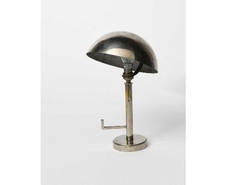 A silvered metal Modernist table lamp, circular base with central rod column and L shaped panel, angled domed shade unsigned,