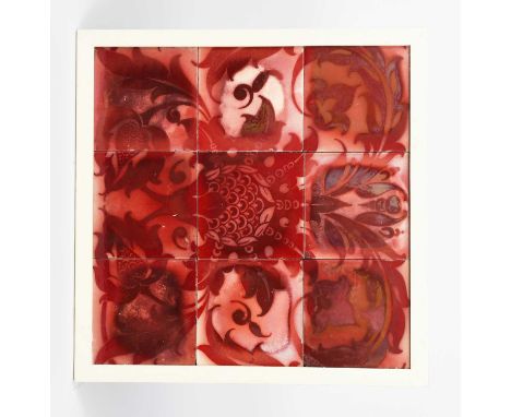 A nine tile panel probably Maw & Co, painted with a large stylised flower with scrolling foliage, in ruby lustre on white gro
