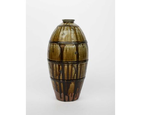 Φ Phil Rogers (1951-2020)Bottlestoneware, swollen cylindrical form with impressed mon and comb motif, covered to the foot wit