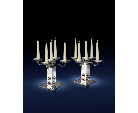 Jean Després (1889-1980)an impressive pair of Modernist silver plated candelabra, square base supporting square section colum