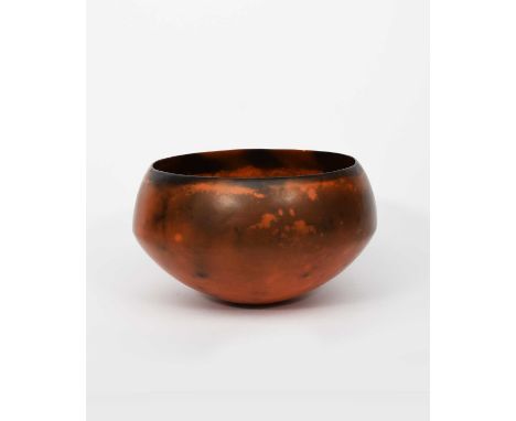 Φ Gabrielle Koch (born 1948)Raku vaselow, flaring form covered in a burnished rust glazeincised signature23cm. diam.15cm. hig