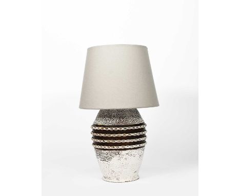 A stoneware lamp base in the manner of Jean Besnard, shouldered form, cast in relief with four geometric bands, textured whit