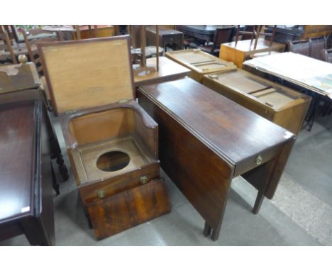 A George III oak dropleaf table and a mahogany commode cabinet 