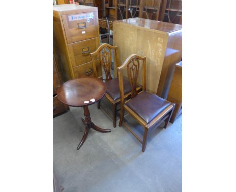 A Victorian Cuban mahogany reeded circular tripod table and a pair of mahogany chairs 