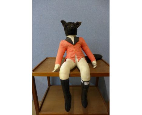 A vintage soft toy fox in hunting attire 