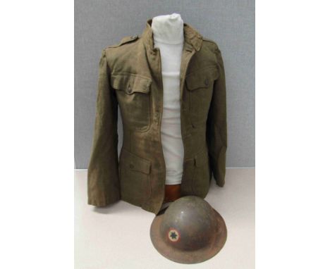 A WWI US soldier's service jacket with US Army insignia and US Army Brodie helmet with division patch to the front