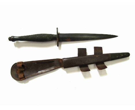 A Fairbairn Sykes commando dagger with sheath