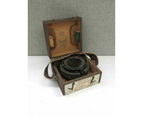 A WWII Air Ministry P8 aircraft compass, cased with inspection stamps 